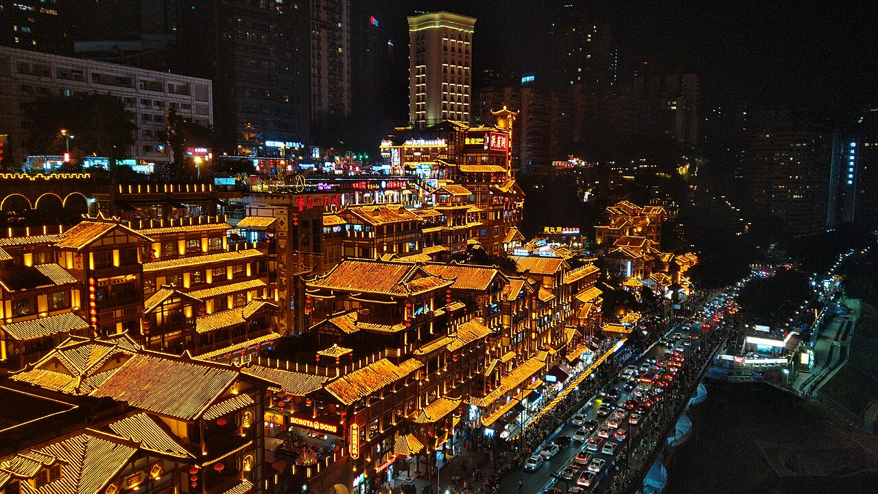 Hongya Cave lit up at night, seen from Qiansimen Bridge