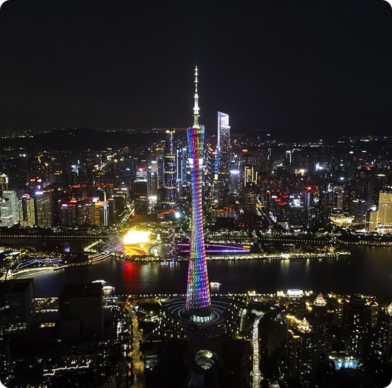 The Canton Tower glowing over the river in Guangzhou at night