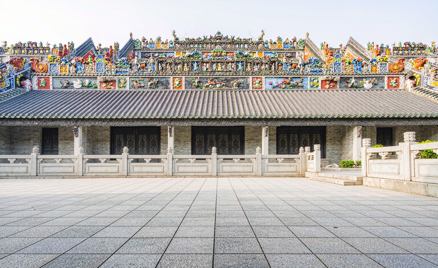 The glazed ceramic figures crowding the roof ridge of the Chen Clan Academy, Guangzhou